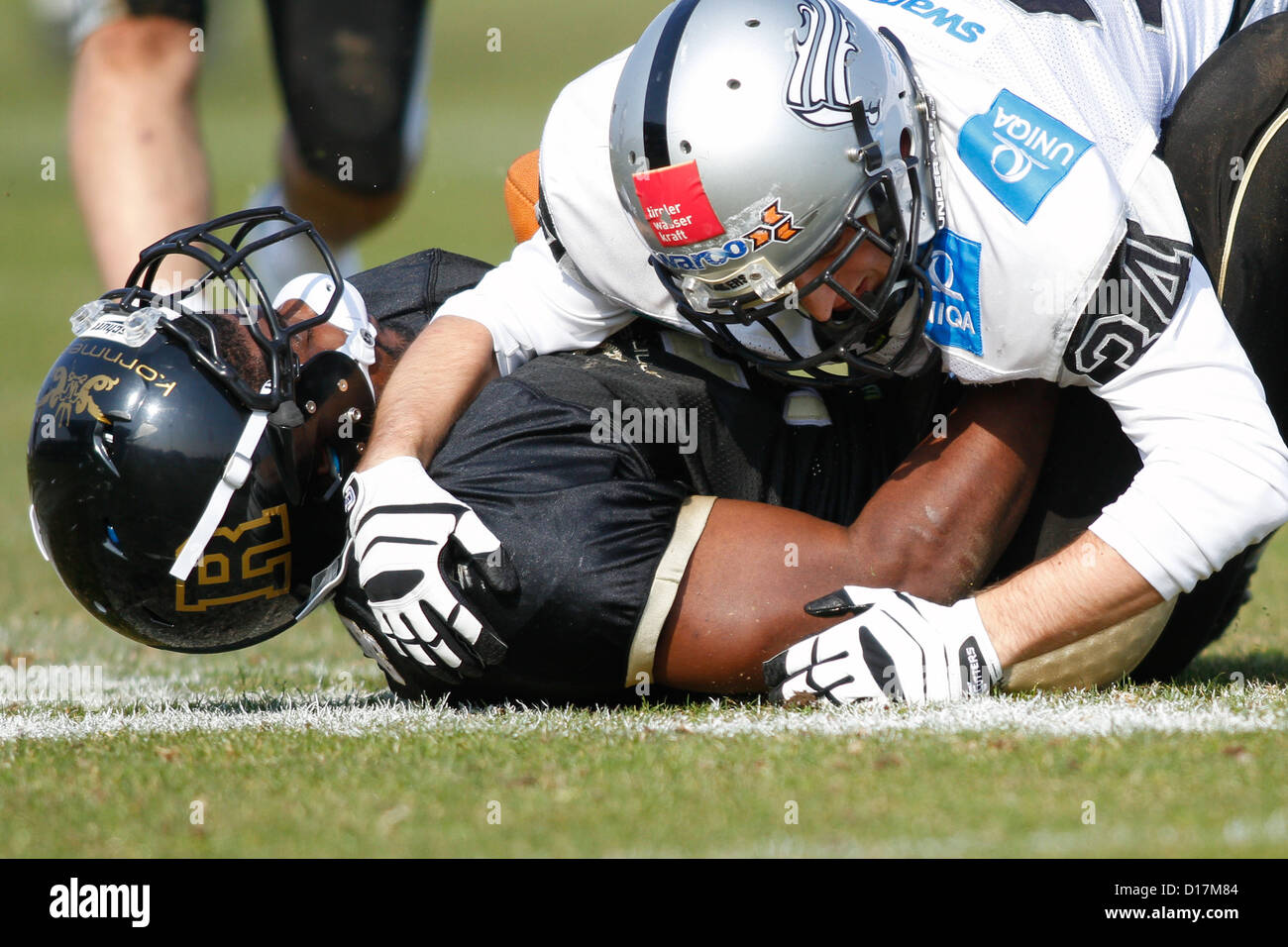 Zacchaeus Mccaskill (#3 Rangers) is tackled by LB Julian Hackl (#34 Raiders) on March 24, 2012 in Vienna, Austria. Stock Photo