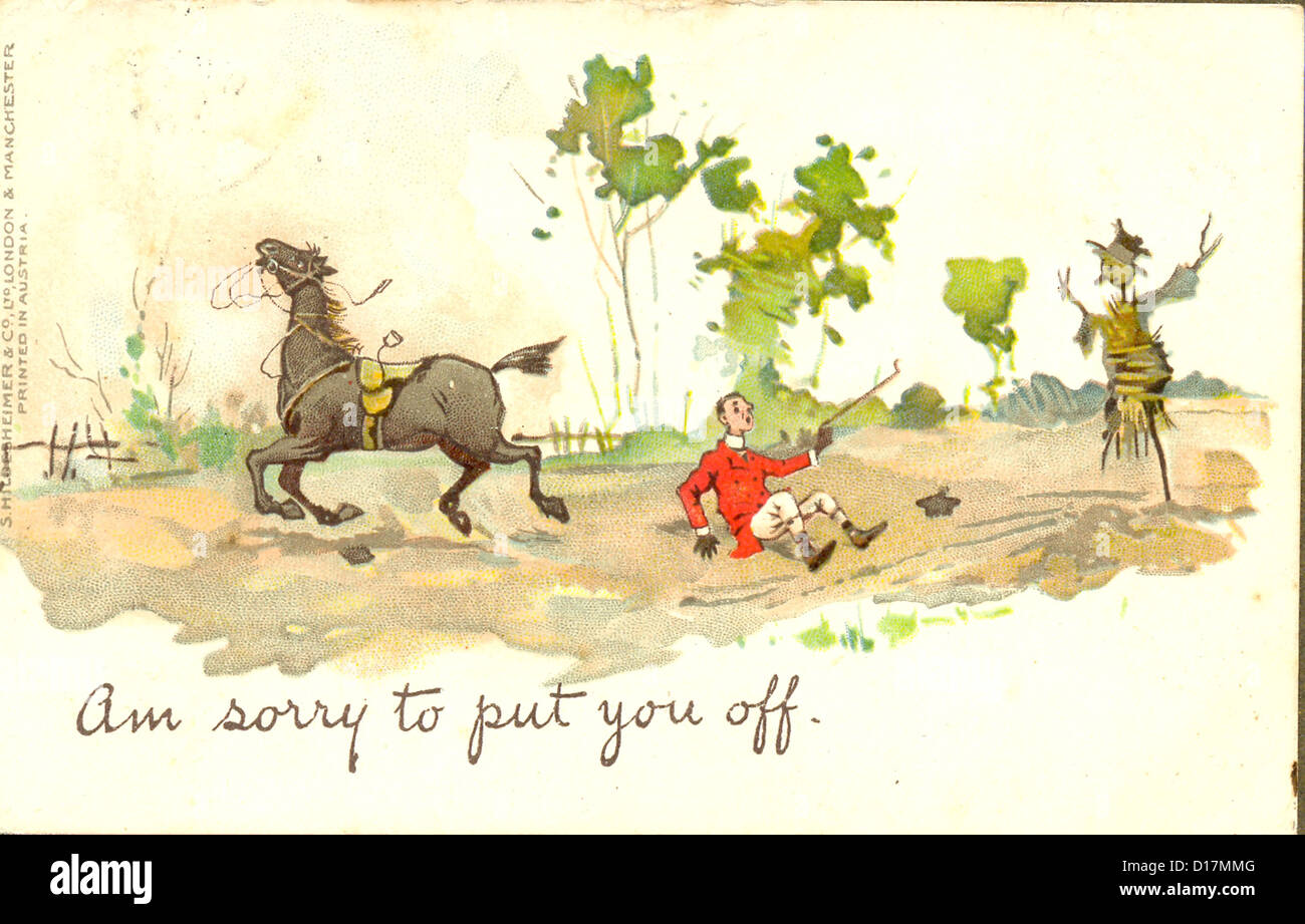 Comic Edwardian postcard with rider falling from his horse which had shied at a scarecrow circa 1908 Stock Photo