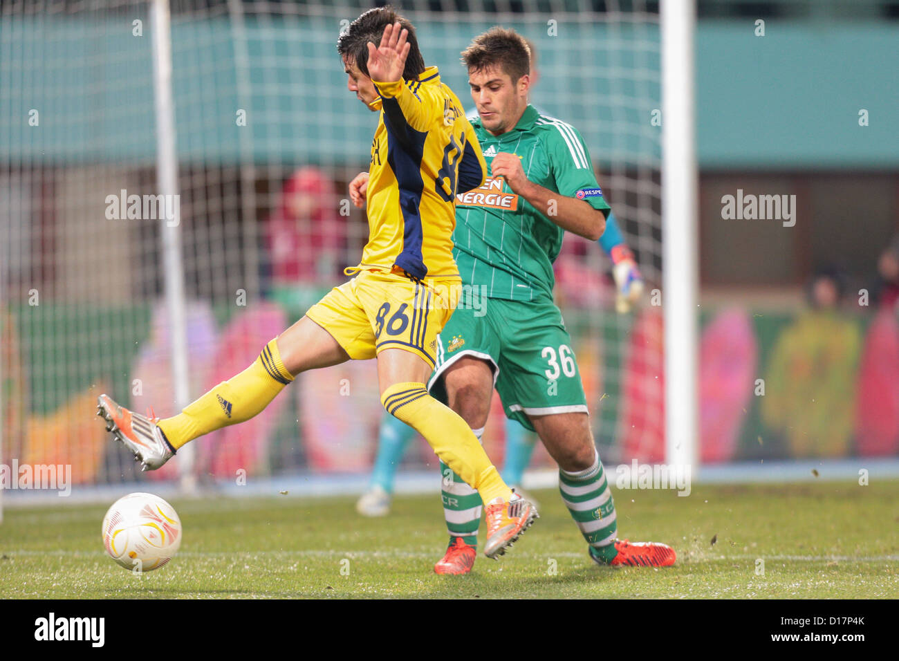 Michael Schimpelsberger (#36 Rapid) and Willian (#86 Metalist) fight for the ball on December 6, 2012 in Vienna, Austria. Stock Photo