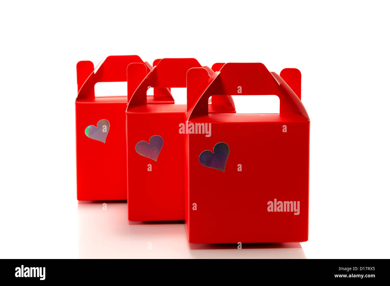 three red gift boxes isolated on white Stock Photo - Alamy