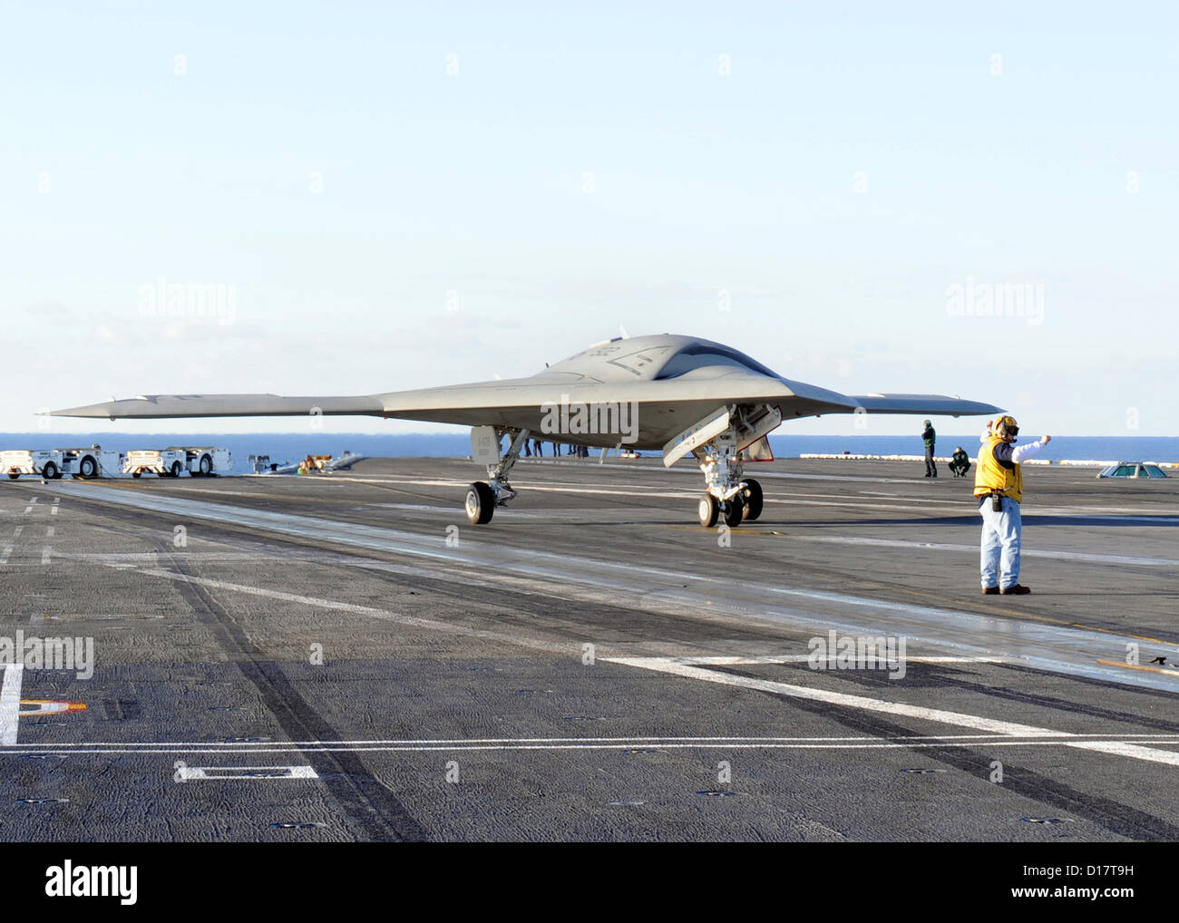 The X-47B Unmanned Combat Air System taxies on the flight deck of the aircraft carrier USS Harry S. Truman underway December 9, 2012 in the Atlantic Ocean. The Harry S. Truman is the first aircraft carrier to host test operations for an unmanned aircraft. Stock Photo