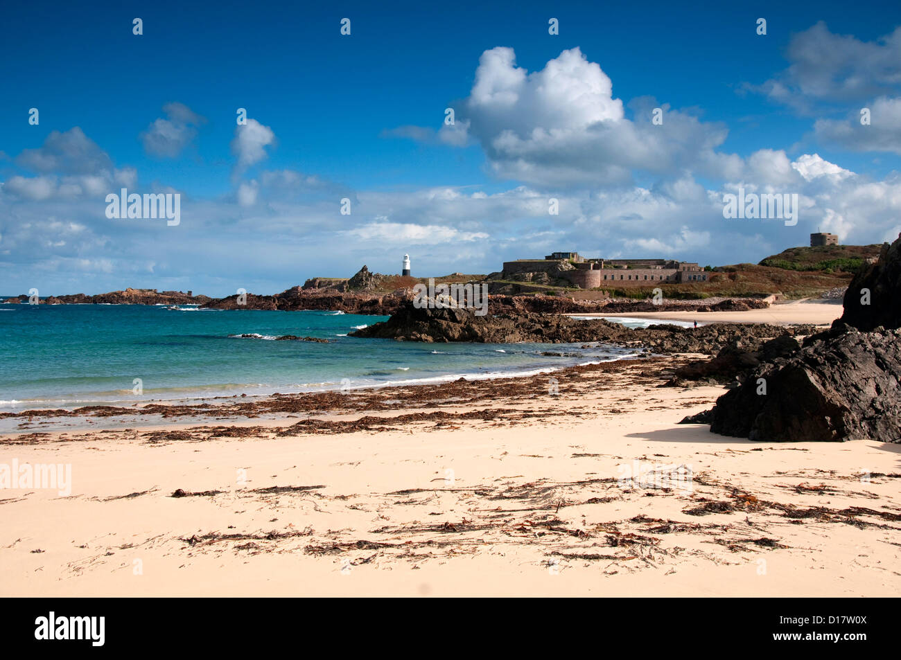 Quesnard Lighthouse from Corblet's Bay on Alderney, Channel Islands ...