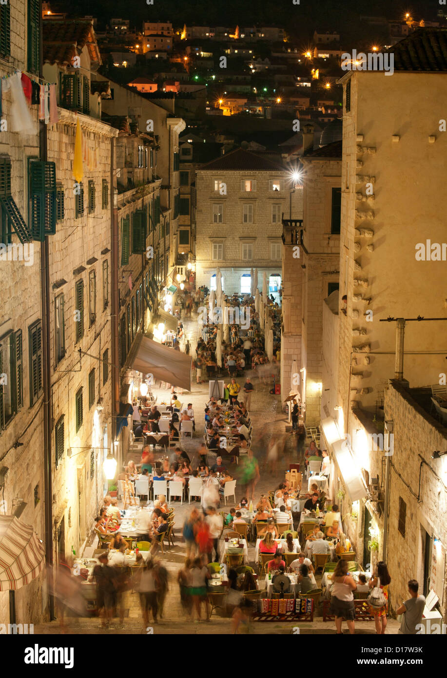 Crowded restaurants on Uz Jezuite street in the old town in Dubrovnik on the Adriatic coast of Croatia. Stock Photo