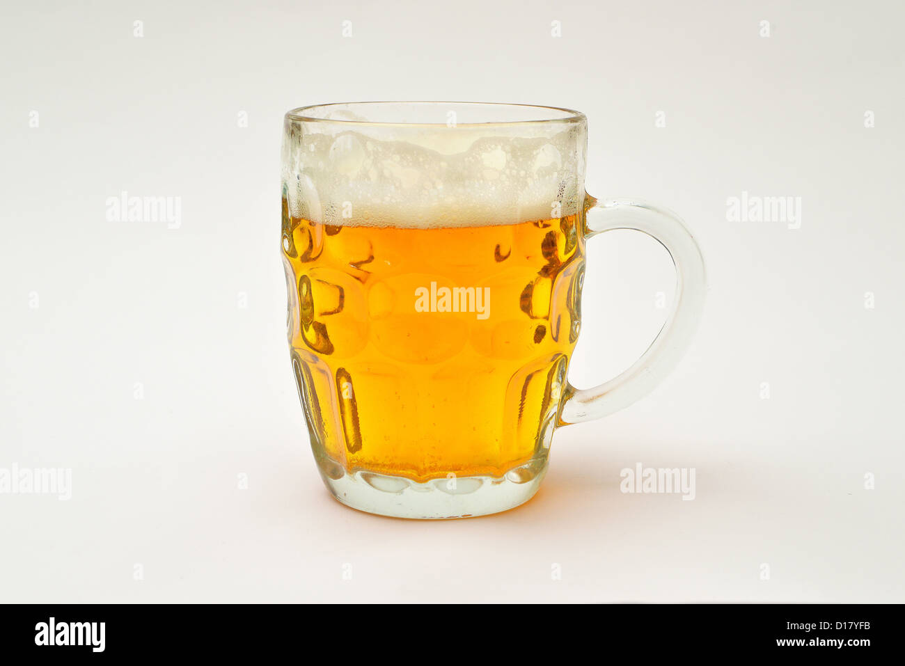 Mug half filled with cold, fresh light beer Stock Photo