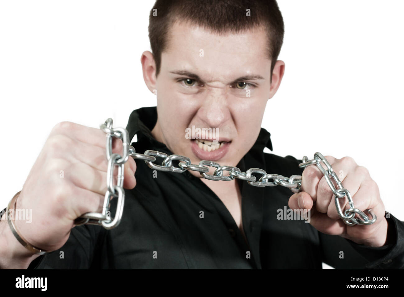 Angry young man wants to break the chains Stock Photo Alamy
