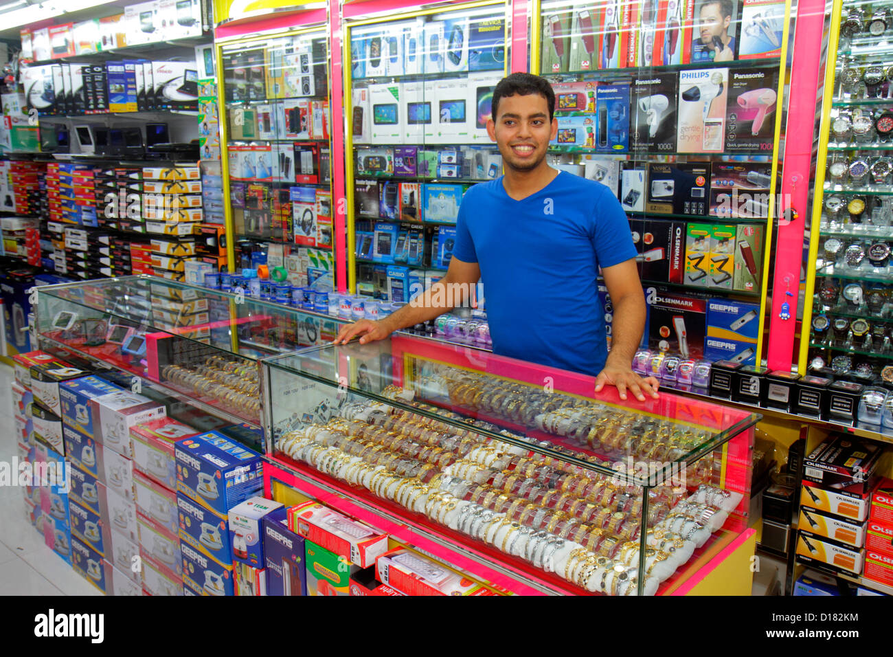 Dubai UAE,United Arab Emirates,Al Souqe Al Kabeer,Old Souq,market,merchant,employee merchant,manager,merchant,owner,employee worker workers working,st Stock Photo