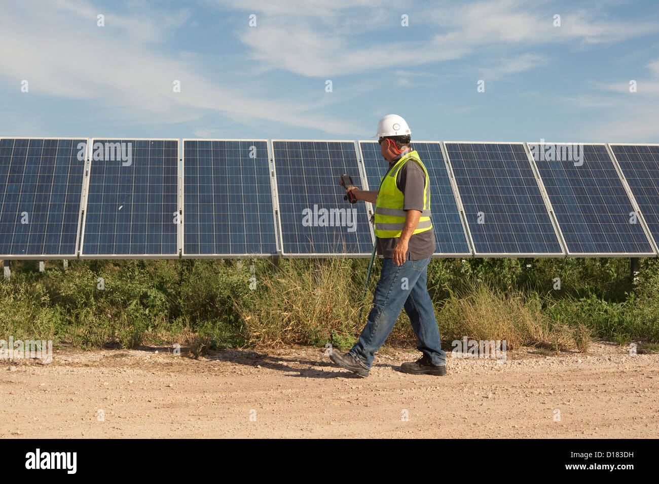 White male uses thermal imaging camera to perform quality control and