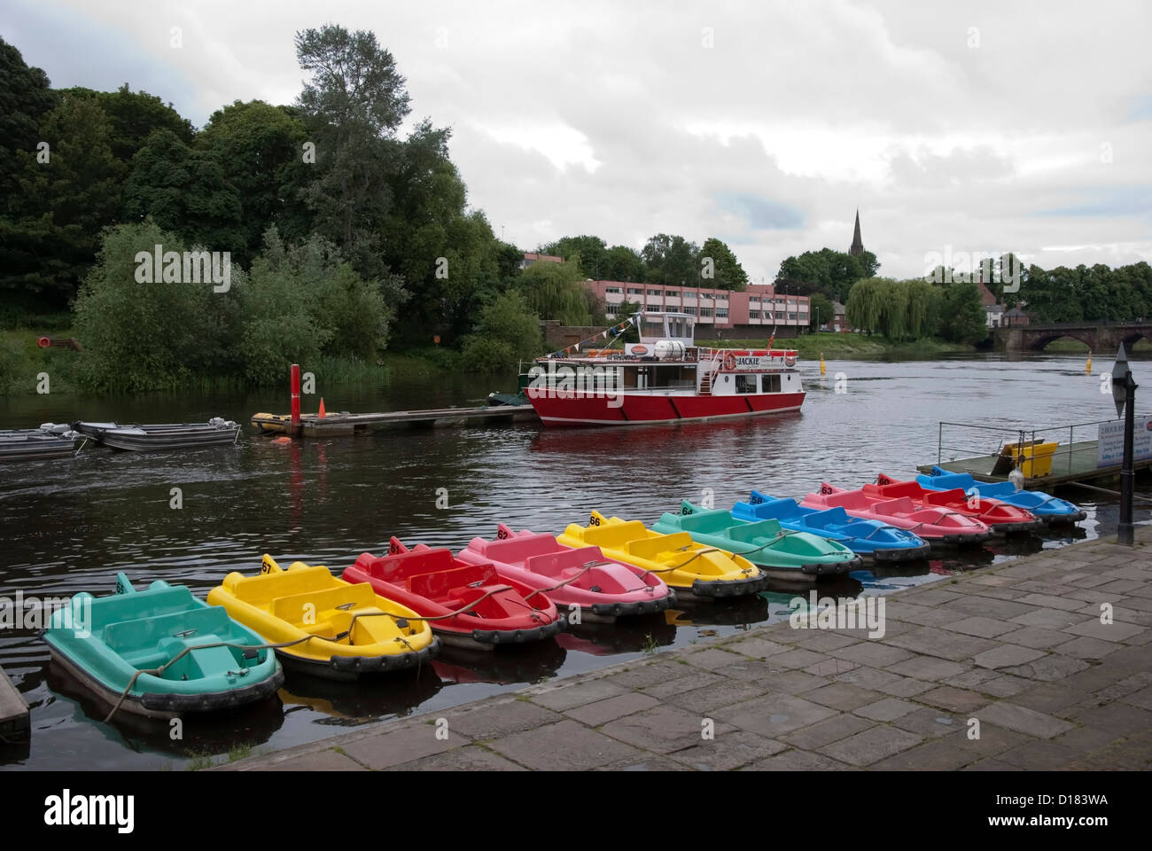 A Row of Brightly Coloured Pedal Boats and Jackie Sightseeing Boat