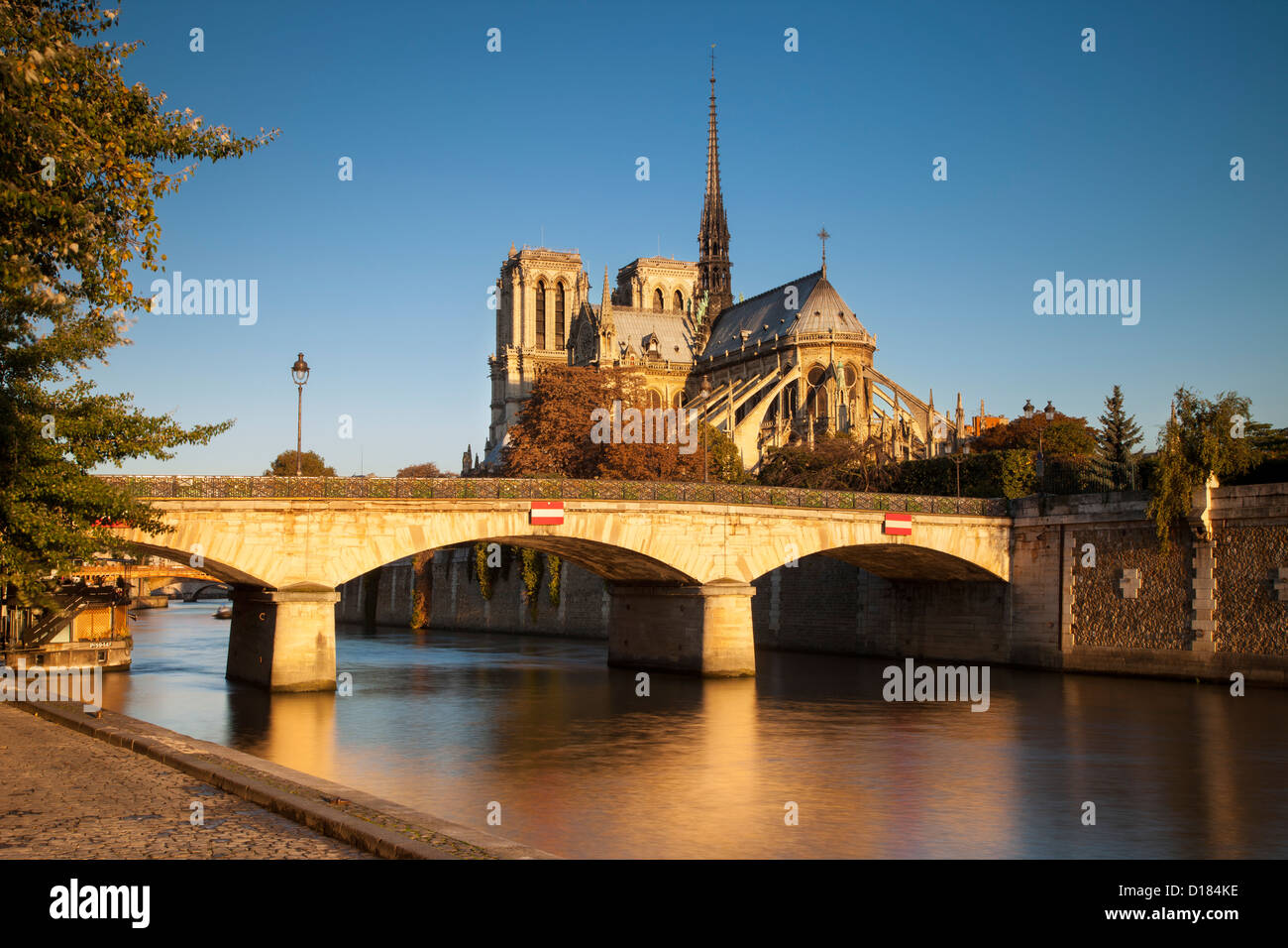 Sunrise over Cathedral Notre Dame along the banks of River Seine, Paris France Stock Photo
