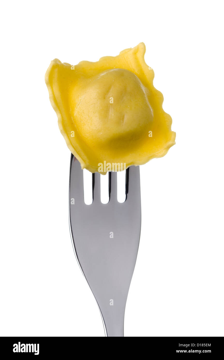 ravioli pasta parcel on a fork against white Stock Photo Alamy