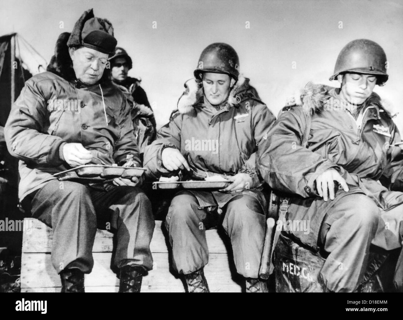 President-elect Dwight Eisenhower eating with soldiers in Korea on Dec. 1, 1952. One of the men, Corporal James Murray (right), Stock Photo