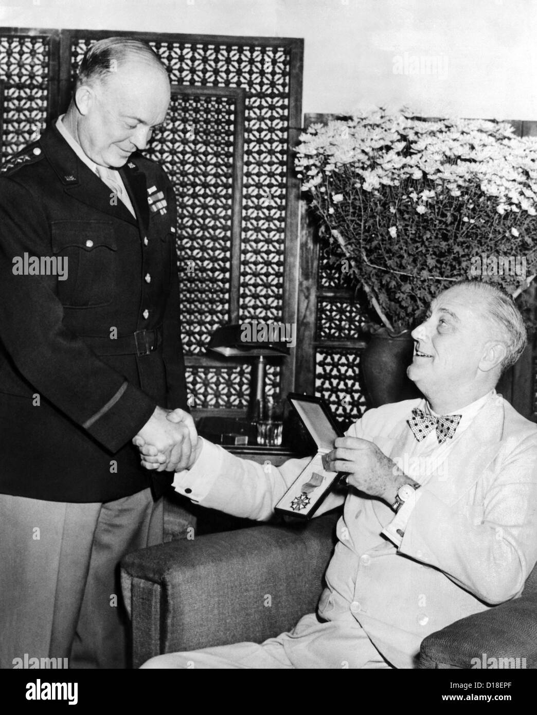 President Franklin Roosevelt presents Legion of Merit to General Eisenhower. President Roosevelt was awarded the medal during Stock Photo