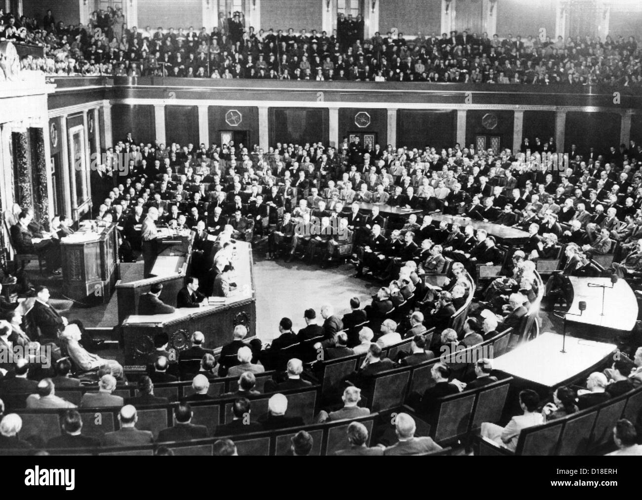 President Eisenhower delivers his first State of the Union message. On rostrum behind him are VP Nixon and House Speaker Joe Stock Photo
