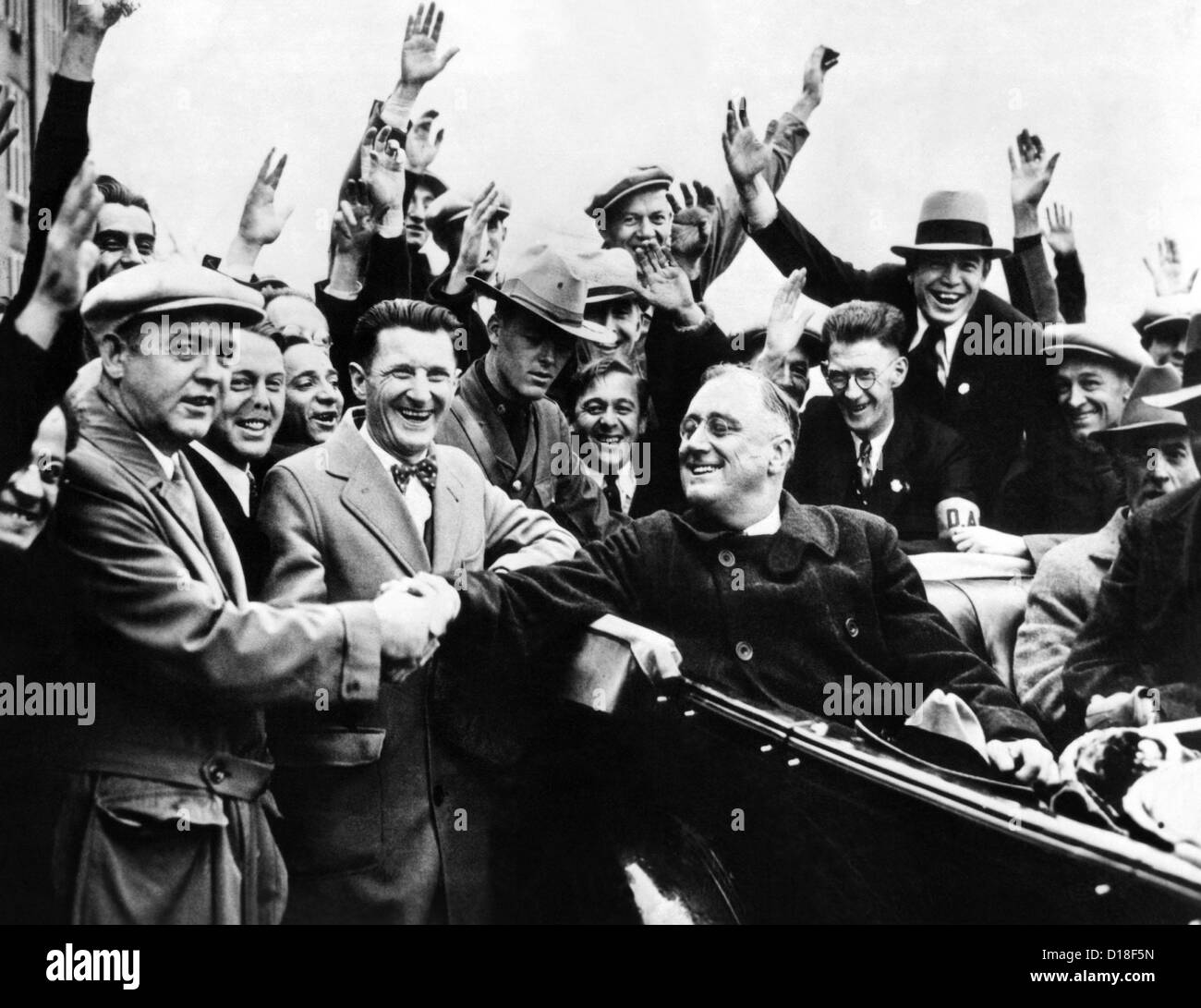 Franklin Roosevelt in the back seat of his car, surrounded by cheering citizens. 1930s. (CSU ALPHA 33) CSU Archives/Everett Stock Photo