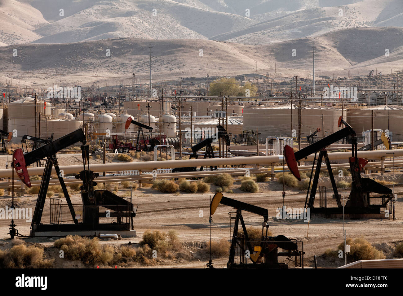 Oil pumps and refinery in oil field Stock Photo