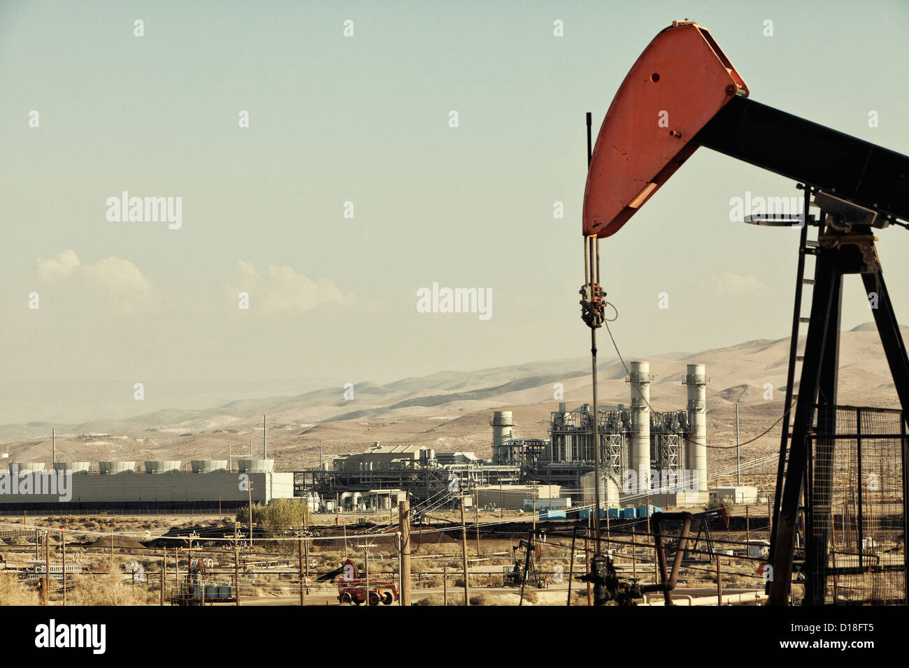 Oil pump and refinery in oil field Stock Photo