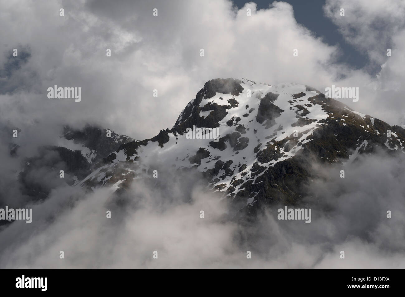 Aerial view of clouds and snowy mountain Stock Photo