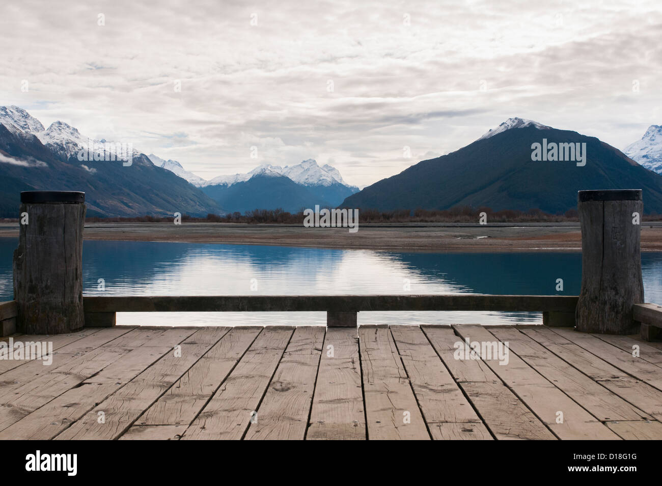 Wooden dock on still rural lake Stock Photo