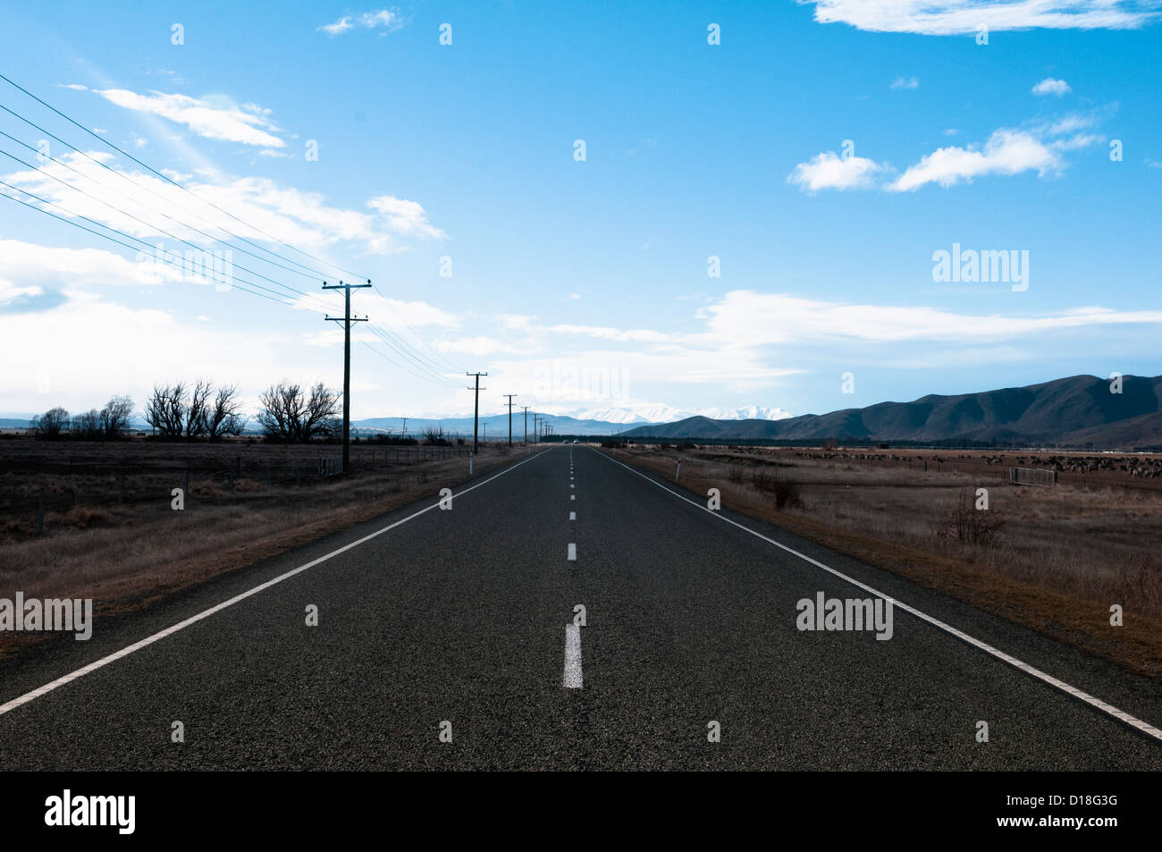 Paved road in rural landscape Stock Photo