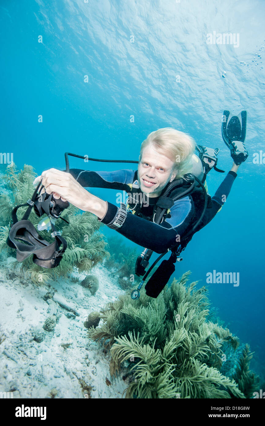 Diver swimming without mask Stock Photo