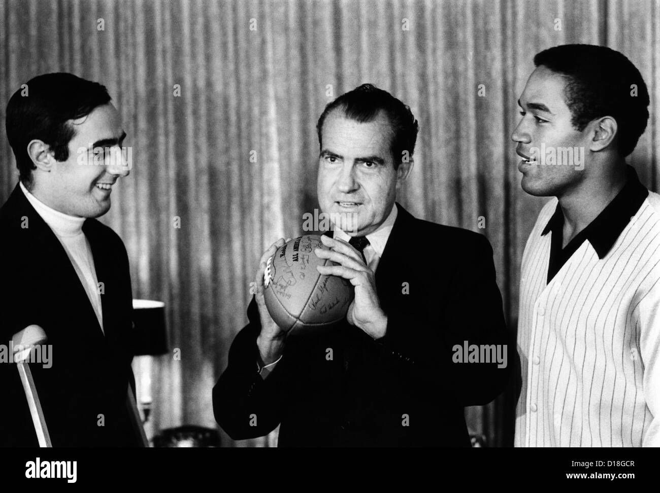 President-elect Richard Nixon was visited by All-Americans. L-R: Notre Dame quarterback Terry Hanratty, Nixon, USC running back Stock Photo