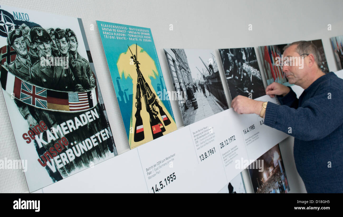 Research assistant, Uwe Klar, is pictured in front of a timeline of photographs in the permanent exhibition of Seelow Heights Museum in Seelow, Germany, 10 December 2012. A new permanent exhibition will be opened in the museum on 15 December 2012. Photo: Patrick Pleul Stock Photo