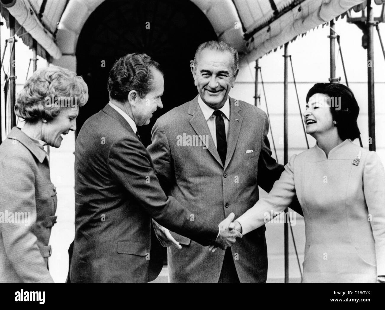 President Lyndon and Lady Bird Johnson greet President-elect, Richard Nixon and wife Pat Nixon. They were served a White House Stock Photo