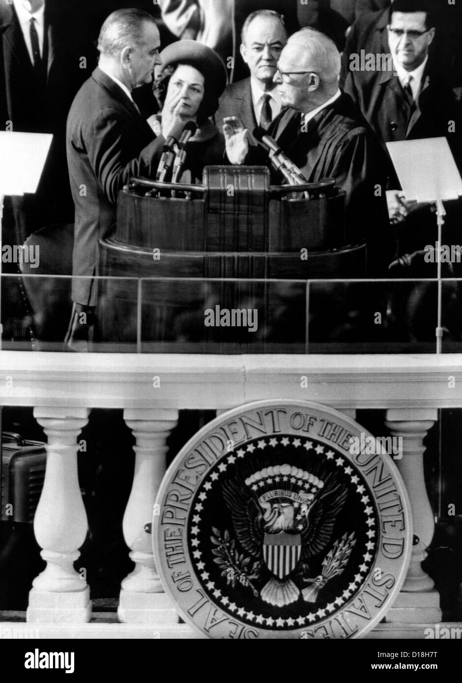 President Johnson takes the oath of office at his 1964 Inauguration. L-R: President and Mrs. Johnson; Vice President Hubert Stock Photo