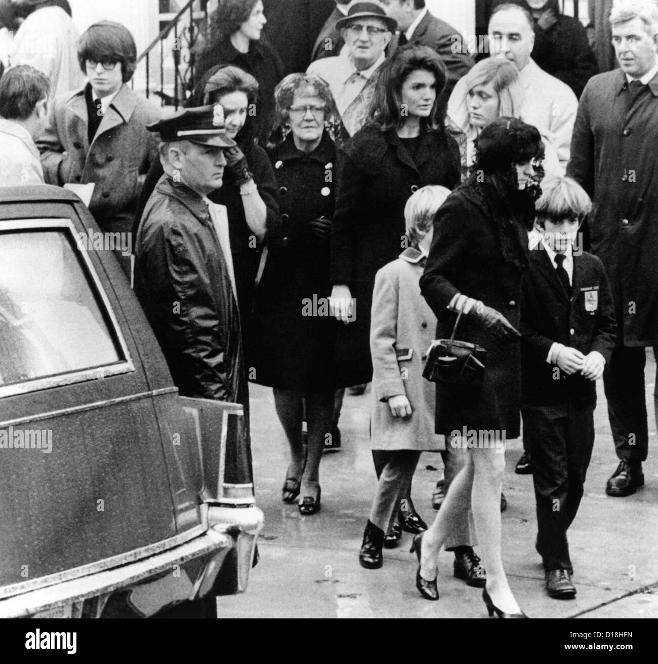Kennedy family at the funeral of Joseph P. Kennedy. In the center is Jacqueline Kennedy Onassis and son, John, Jr., who is with Stock Photo