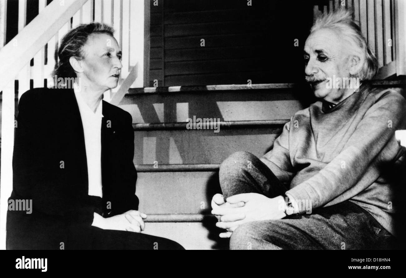 Madame Joliot-Curie and Albert Einstein. The two Nobel Prize winning physicists talk on the steps of Einstein's home in Stock Photo