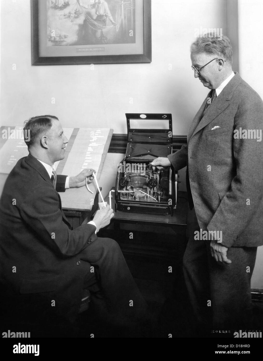 Stock brokers with a new box shaped stock ticker in May 1929. (CSU_ALPHA_1104) CSU Archives/Everett Collection Stock Photo