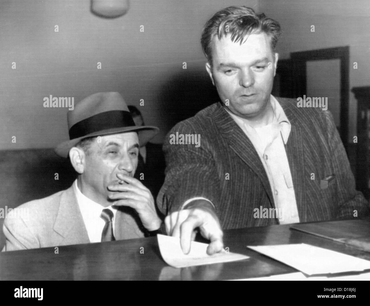 Meyer Lansky is booked on vagrancy charges at the West 54th Street police station in Manhattan. Lansky was arrested as he Stock Photo