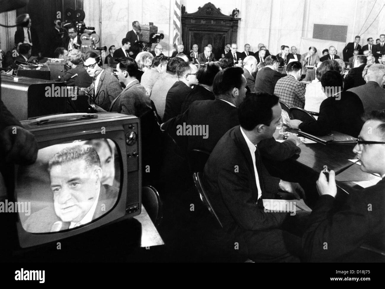 Senate Caucus Room during Joseph Valachi's testimony. Valachi is seen on the TV monitor and members of the Committee are shown Stock Photo