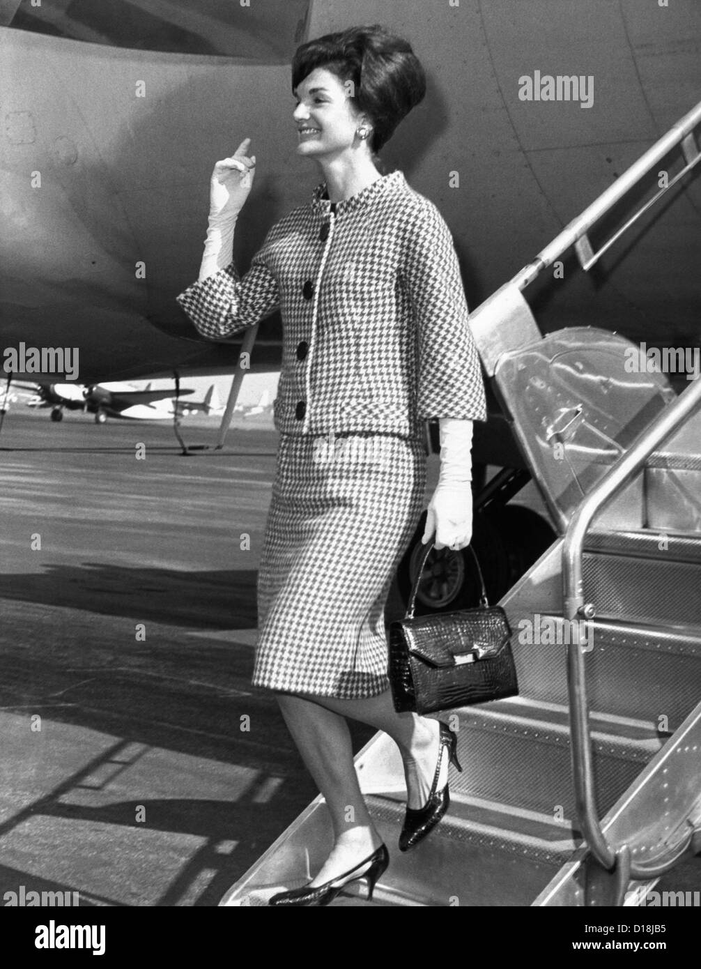 Jacqueline Kennedy deplanes in New York City. She would receive a citation for her contribution to culture and the arts from Stock Photo