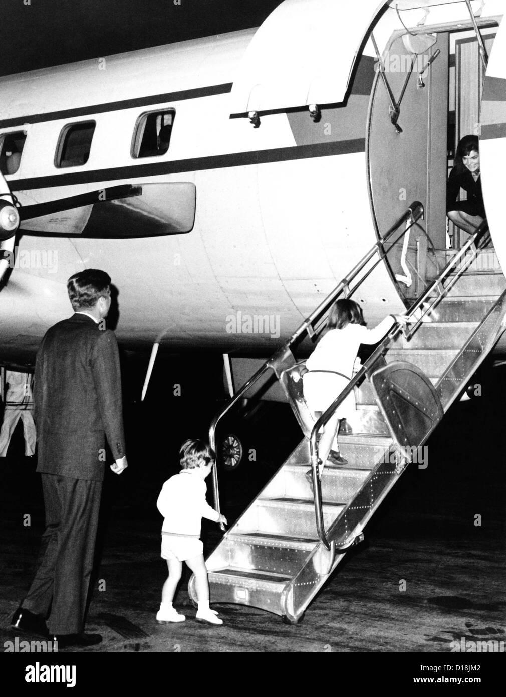 Jacqueline Kennedy is welcomed home by her family after her two week Mediterranean and Moroccan vacation as a guest on Stock Photo