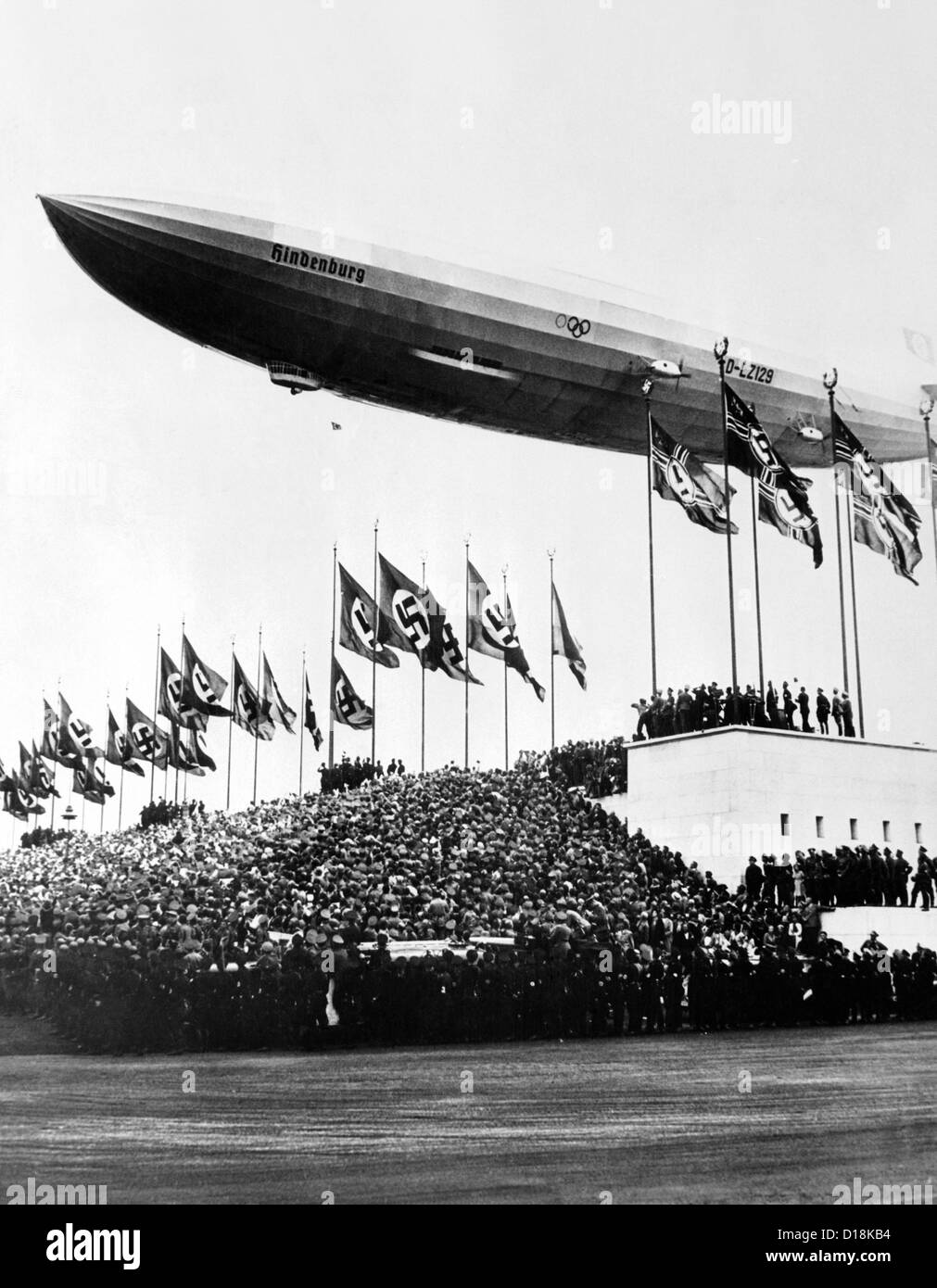 The Hindenburg, flying low in salute of the Nazi hosts of the Nuremberg Congress. Shortly afterward it departed for the United Stock Photo