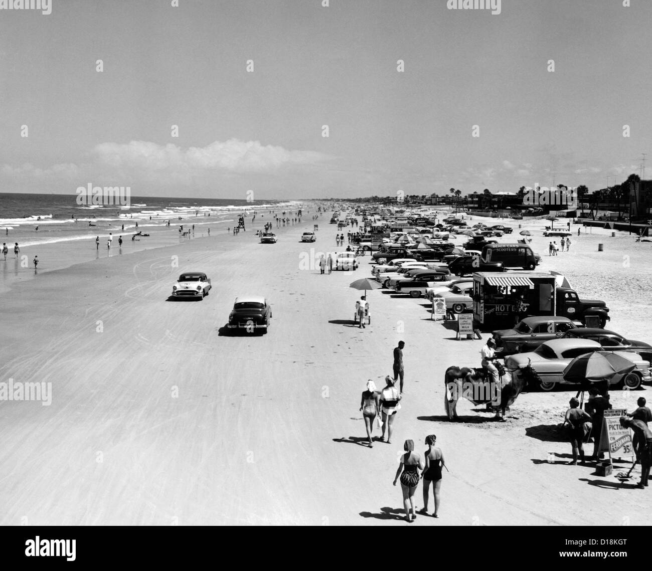 Daytona Beach is 23-mile-long and 600 feet wide. It's smooth, compacted sand attracted vehicles of all types. June 27, 1960. Stock Photo