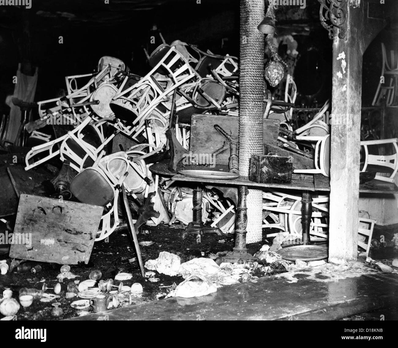 Coconut Grove Nightclub Fire. Charred tables and chairs, broken glass and other debris in the fire-ruined interior of the Stock Photo