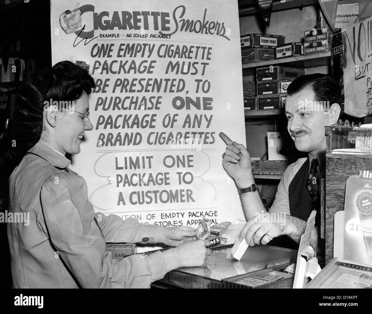 Solution for the wartime cigarette shortage. Ted Pollack, a drug store manager, wants to keep his cigarettes off the black Stock Photo