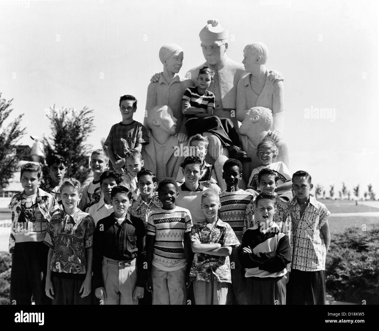 The Soprano Section of the Boys Town Choir is made up of the younger residents, who gather around a statue of Father Flanagan. Stock Photo