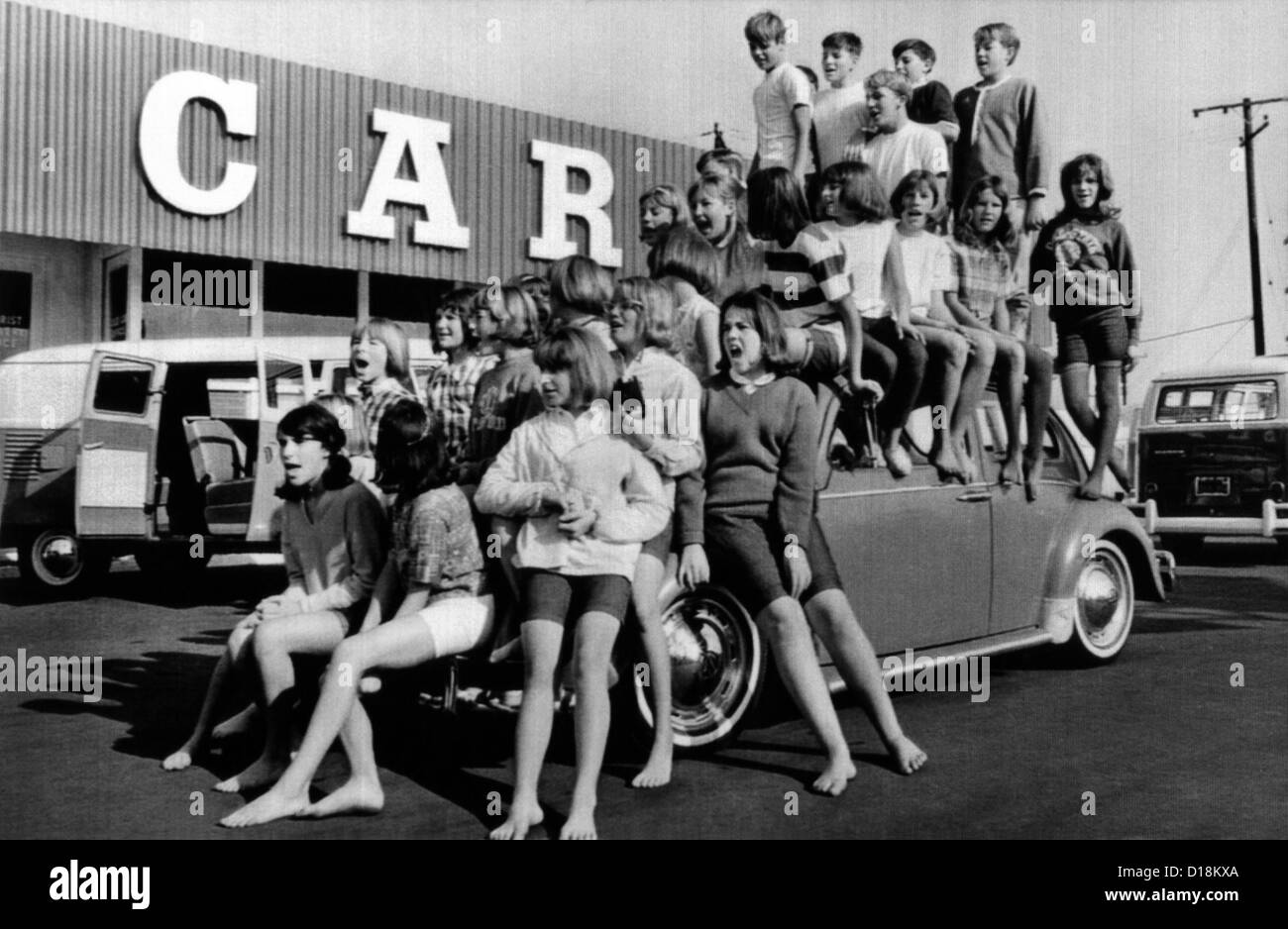 Teenagers would attempt to get this crowd into a Volkswagen Beetle. 31 teenagers had average weight of 100 pounds and average Stock Photo