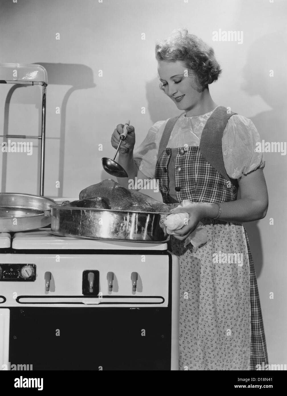 Vintage woman cooking turkey hi-res stock photography and images - Alamy