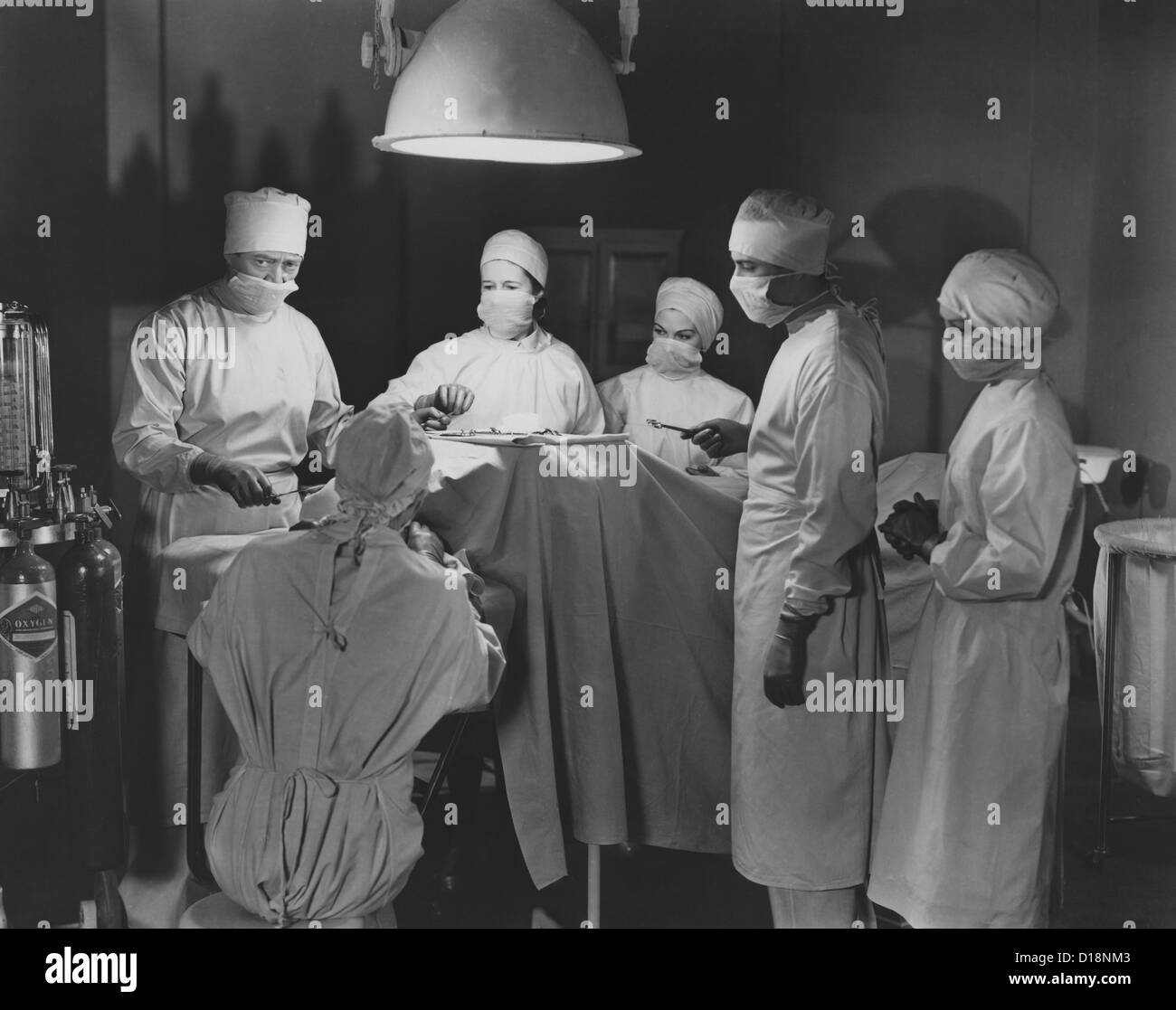 Team of surgeons perform operation Stock Photo