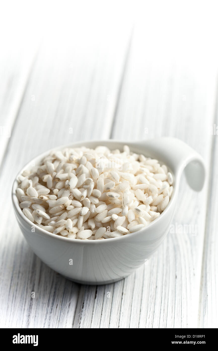 the uncooked arborio rice in bowl Stock Photo Alamy