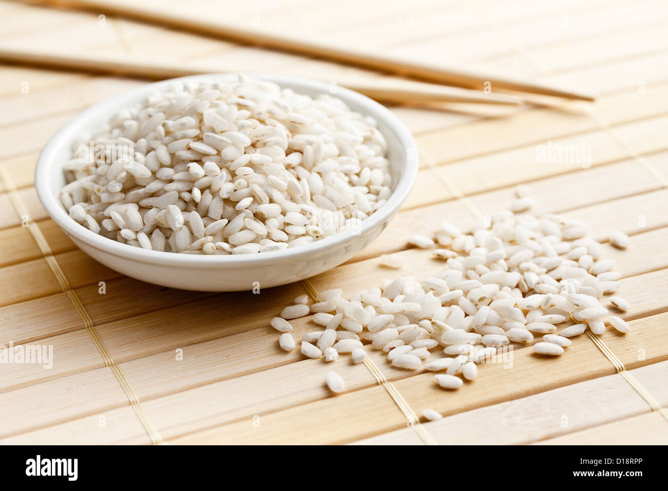 the uncooked arborio rice in bowl Stock Photo Alamy