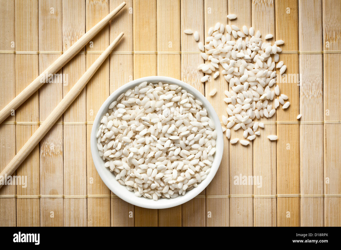 the uncooked arborio rice in bowl Stock Photo Alamy
