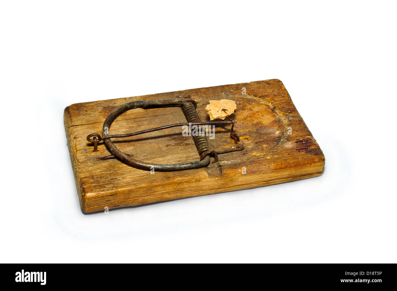 old mousetrap with bait on a white background Stock Photo