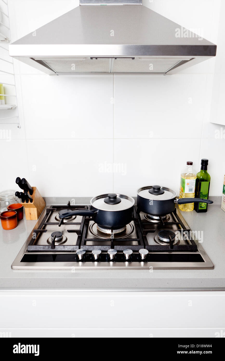 Saucepans on gas hob Stock Photo Alamy