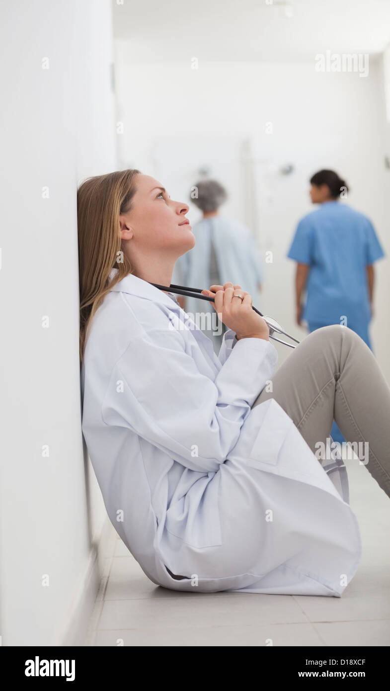 Tired mixed race female doctor hi-res stock photography and images - Alamy