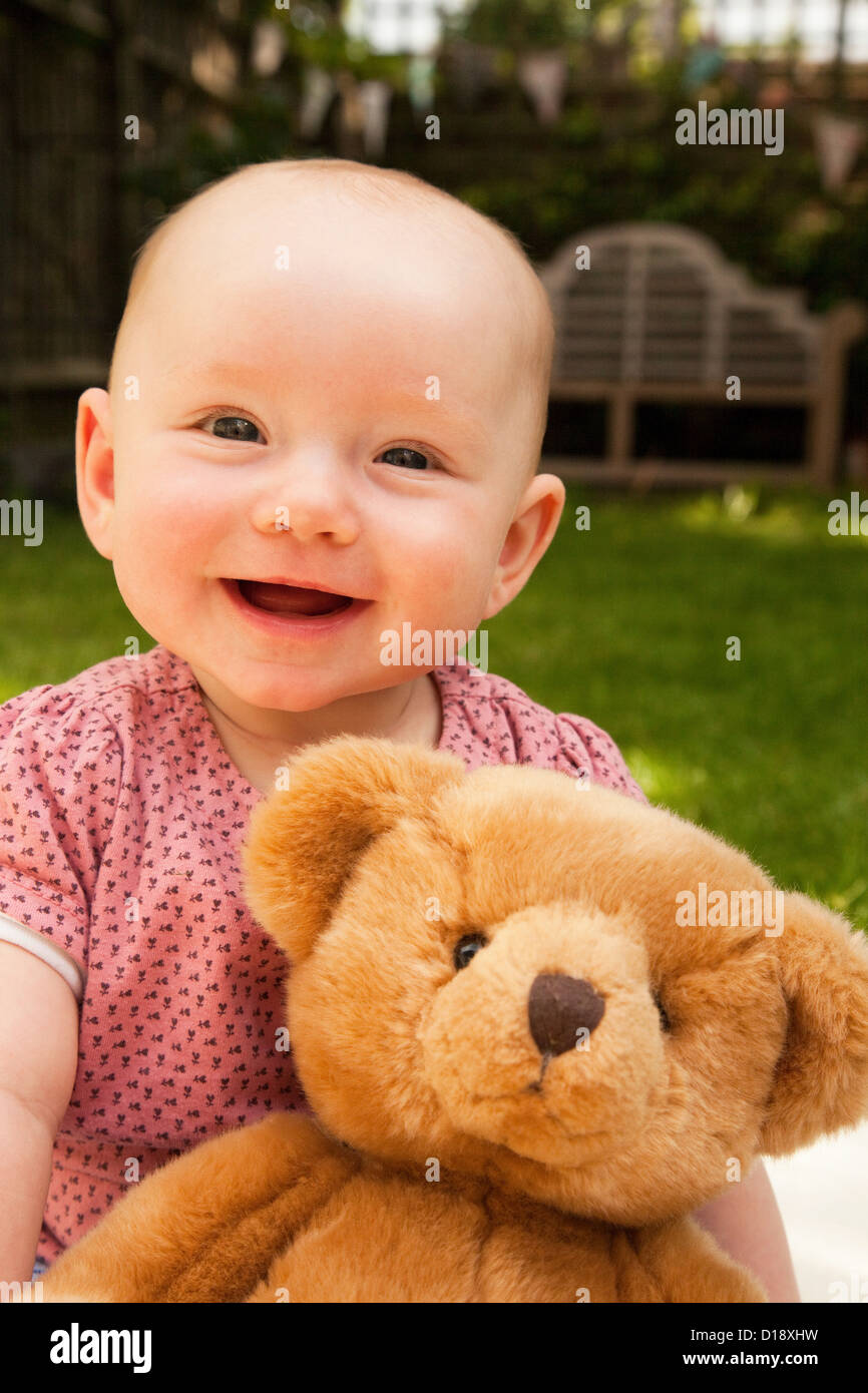 Happy baby girl with teddy bear Stock Photo Alamy